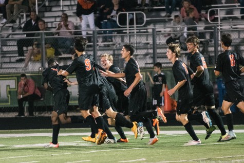 The Boys Varsity Soccer team celebrate junior Stephan Kostov's goal versus Stevenson.