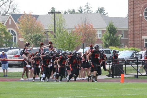 Boys Varsity Football coming out of the locker room before there Homecoming game against St. Joseph. 