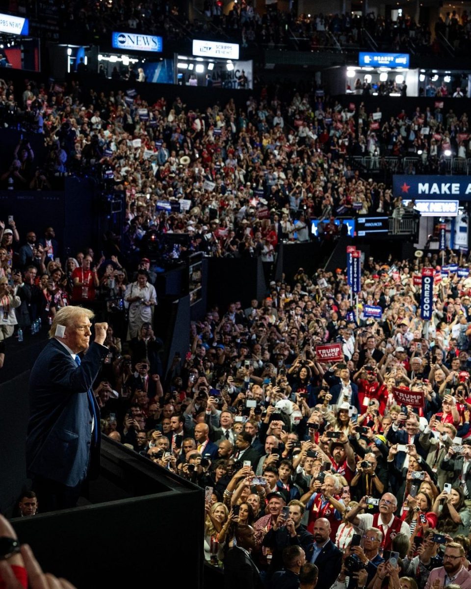 Donald Trump shows solidarity with the crowd at the 2024 Republican National Convention.