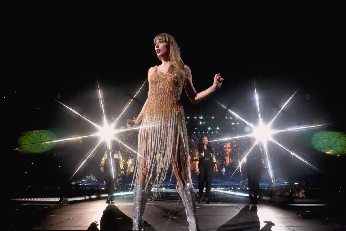 Fearless Era Starts with Long Gold “Noodle” Dress