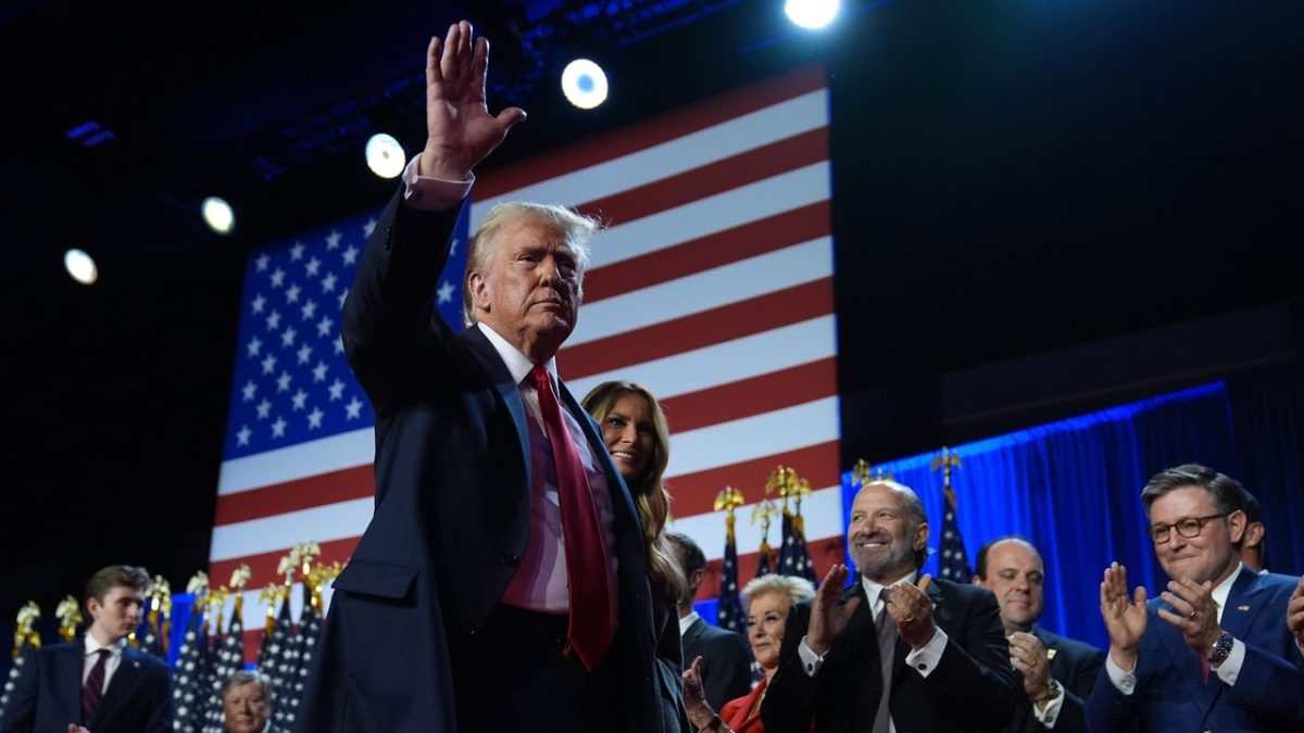 Donald Trump waves to his supporters as he prepares to declare victory in the 2024 United States presidential election.