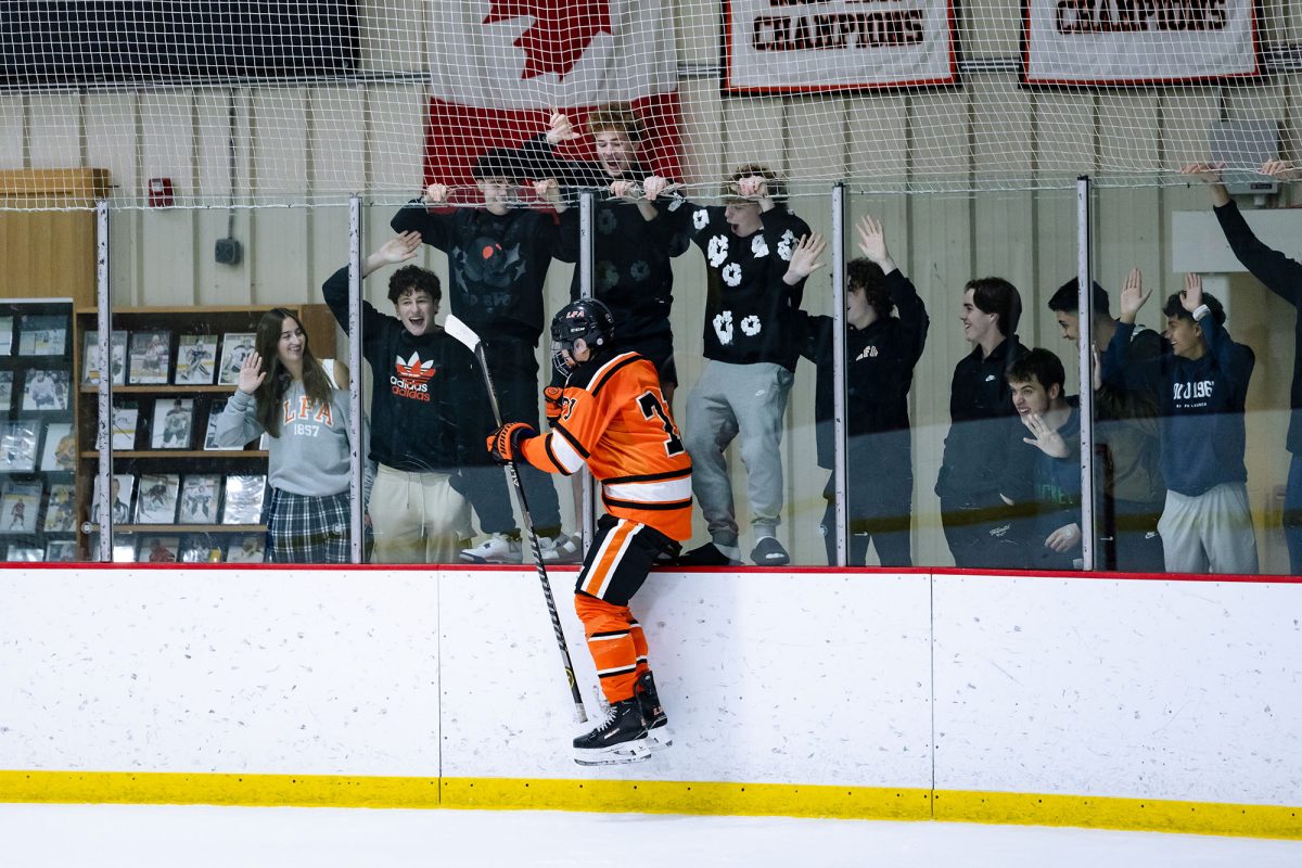 Monte Qu celebrates with his peers after scoring a goal.