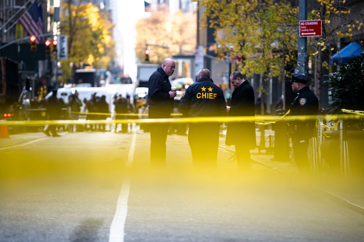 New York investigators observe the scene where UnitedHealthcare CEO Brian Thompson was shot. (Courtesy of the New York Times)