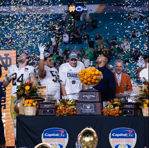 Notre Dame celebrates after they win the Orange Bowl.