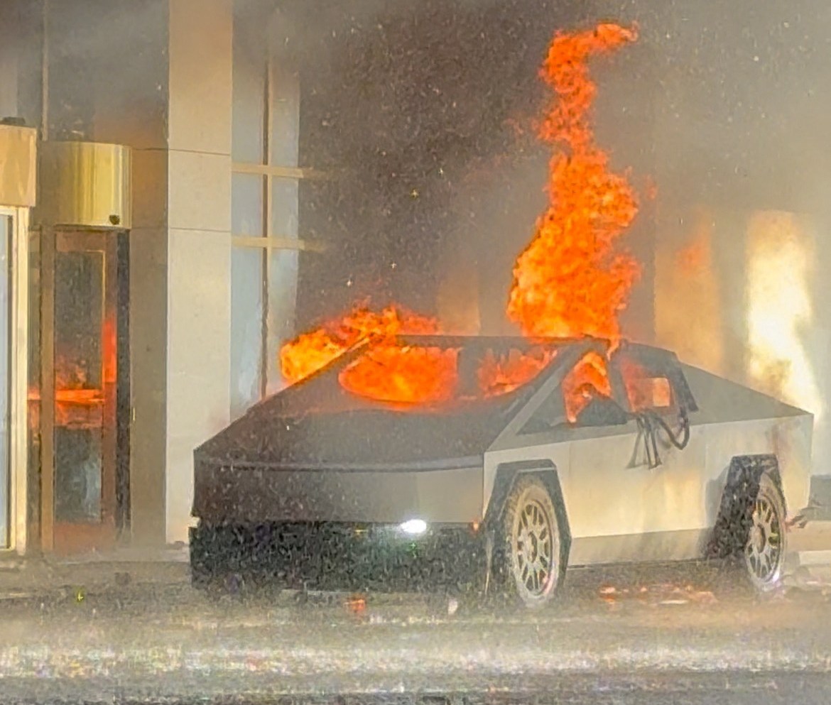 The Tesla Cybertruck is engulfed in flames after exploding. (Courtesy of The Seattle Times)