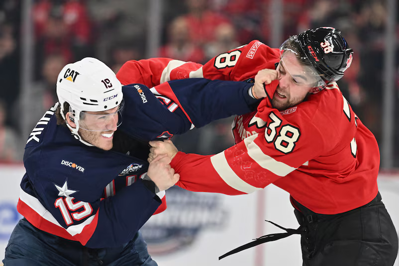 Team USA's Matthew Tkachuk scraps with Canada's Brandon Hagel during round-robin play.