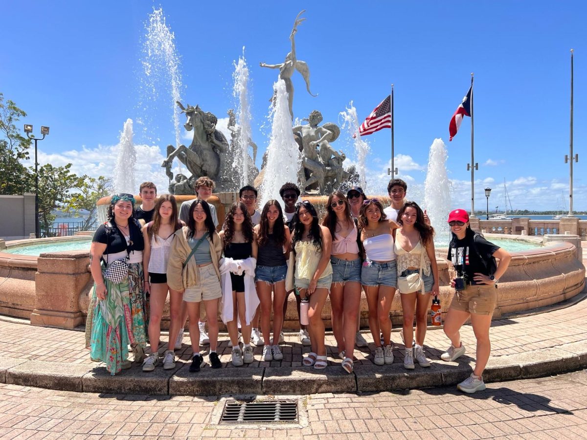 Students pose in front of a fountain in Puerto Rico.