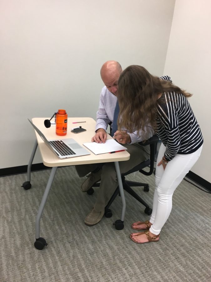 Mr. Makovec helps student, Sasha Blinks understand and get ready for tomorrow’s  assessment about limits.