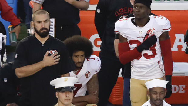 Photo courtesy of CBS News.  Colin Kaepernick kneels during a preseason game in support of Black Lives Matter.