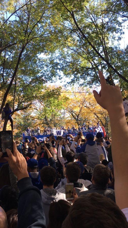 The cheering gets louder and louder as players start going by on the bus