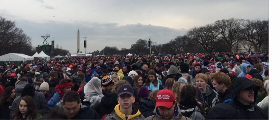 The crowds gather in front of the Capitol Building as they wait for the Inauguration to start. 