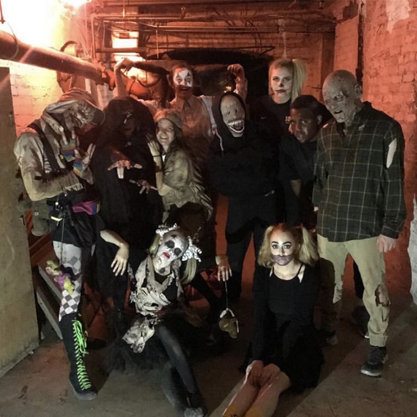 Some of the scarers gather inside the Reid basement, where the 2019 LFA Haunted House took place.