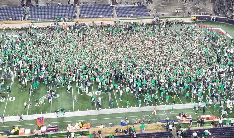 Notre Dame fans rush the field following their win over previously undefeated Clemson