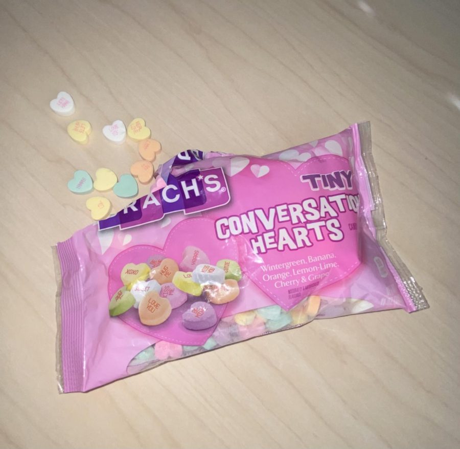 A bag of Brach's Conversation Hearts being shared over a conversation