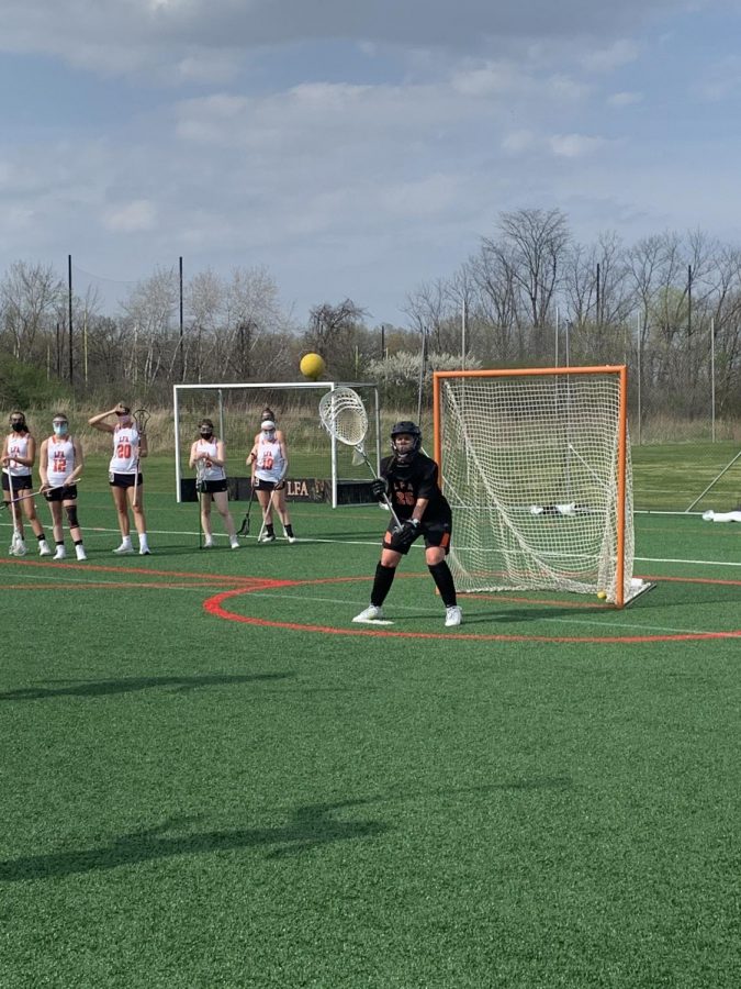 Shayna Goldberg ‘22 saves a lacrosse shot during her first game as goalie.