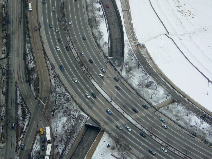 Rooftop view of Lake Shore Drive alongside Lake Michigan in winter. 