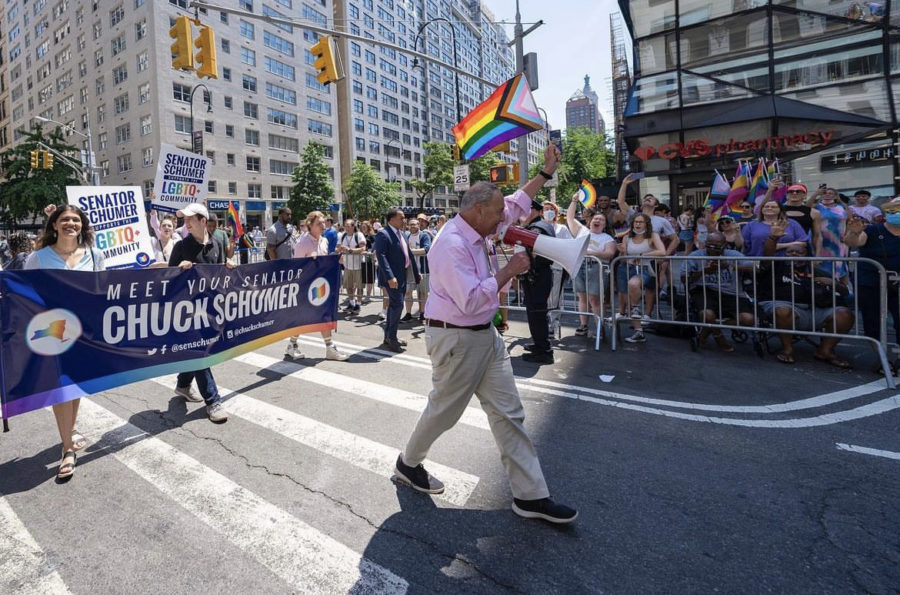 Senate Majority leader and New York Democratic Senator Chuck Schumer leads a march in support of the Respect for Marriage Act.