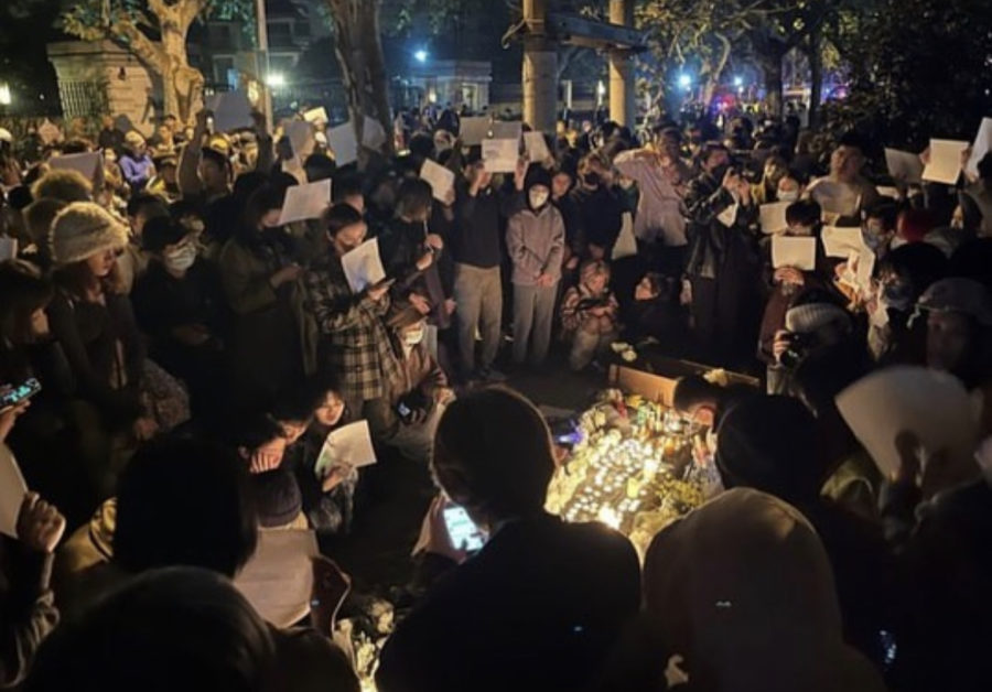 Residents in Shanghai gathered at Urumqi Rd to commemorate people perished in the deadly fire in Urumqi, Xinjiang, holding a white paper in their hands to show support for the A4 Revolution.