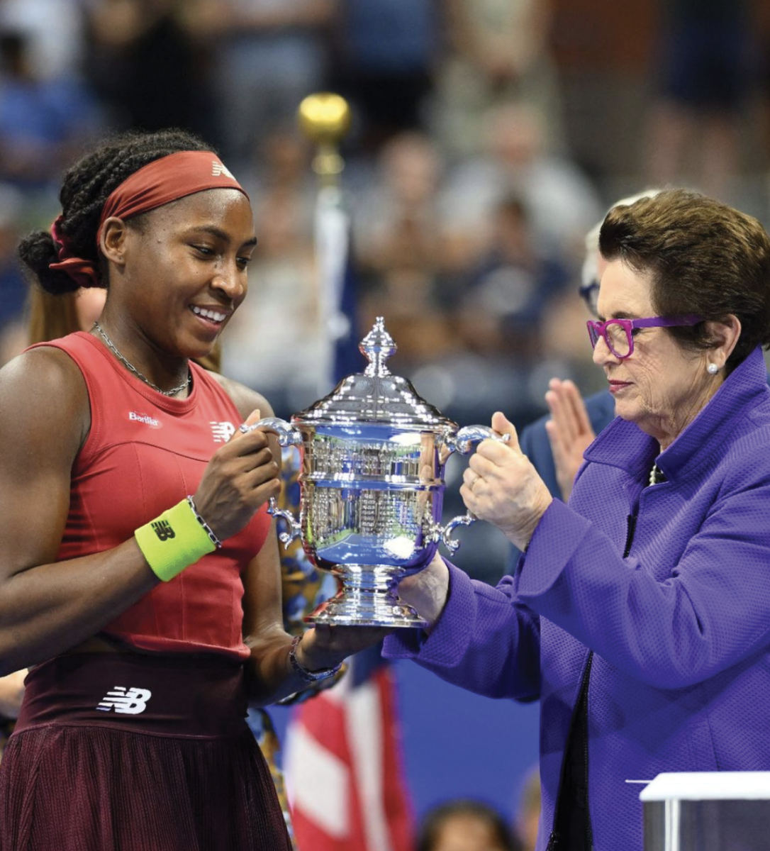 Coco Gauff recieves US Open trophy from retired legend Billy Jean King.