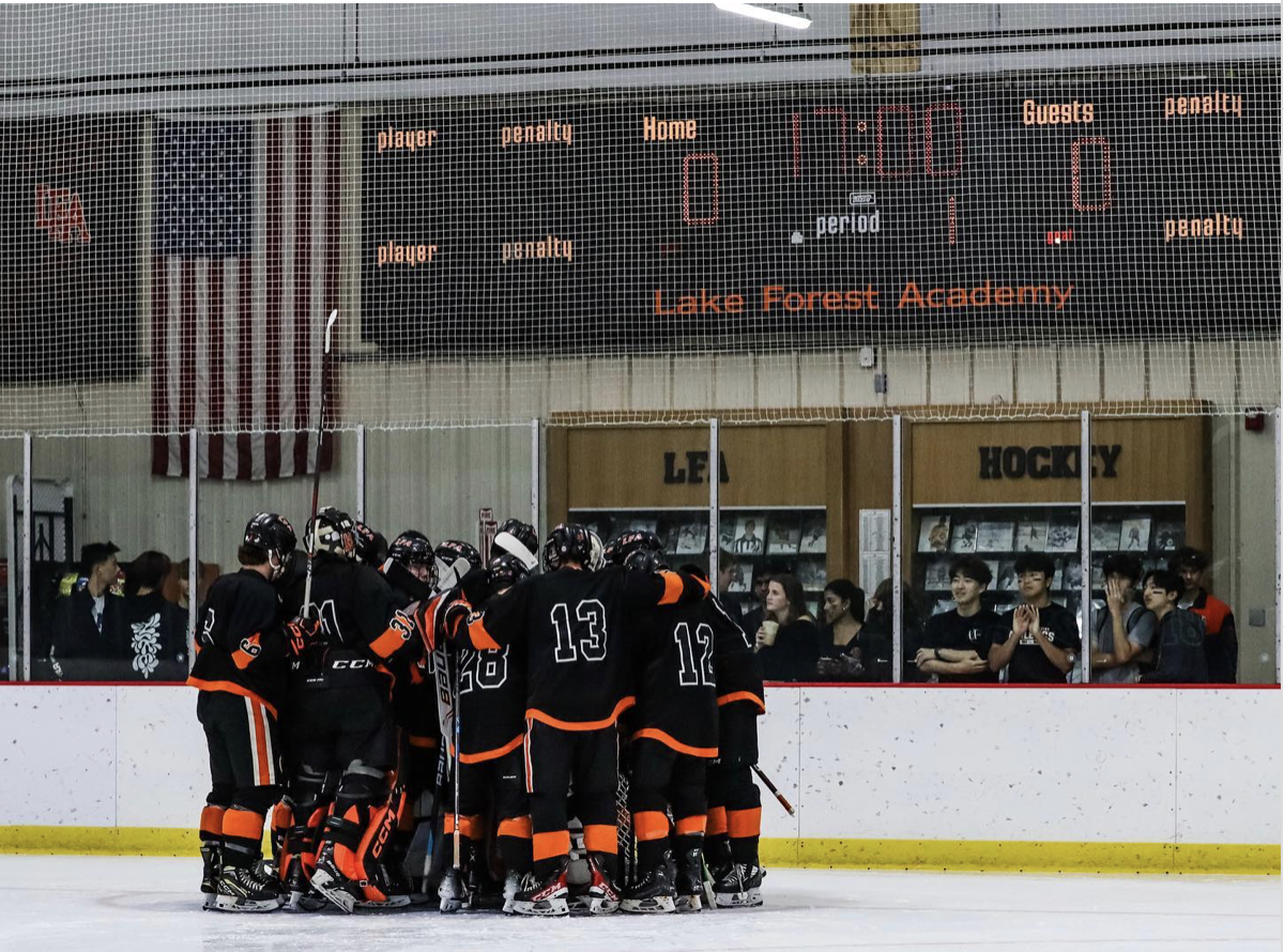 LFA Prep Hockey team huddles during one of their home games.