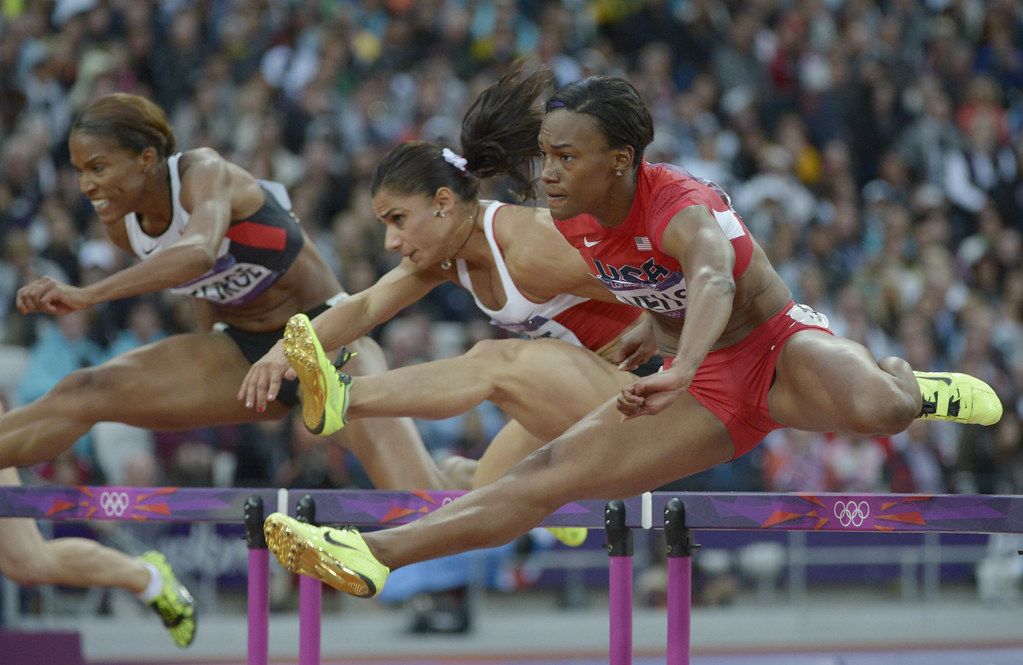 Kellie Wells competes in the women's 100m hurdles semifinals during the 2012 London Olympic Games.