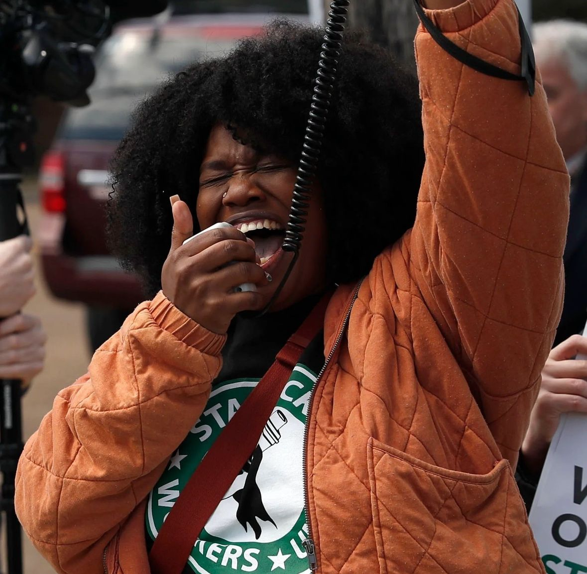 Nikki Taylor, a Starbucks union leader, speaks at a rally.