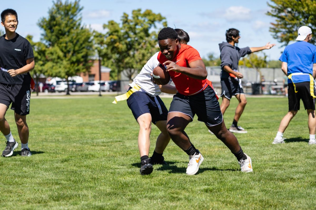 Enos Zaah'25 enjoying flag football during NFL weekend.