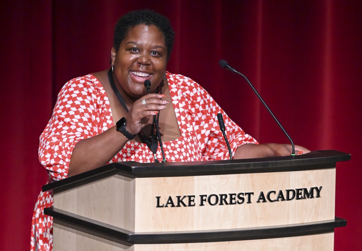 Jennifer Rundles speaks to students at an All School Meeting.