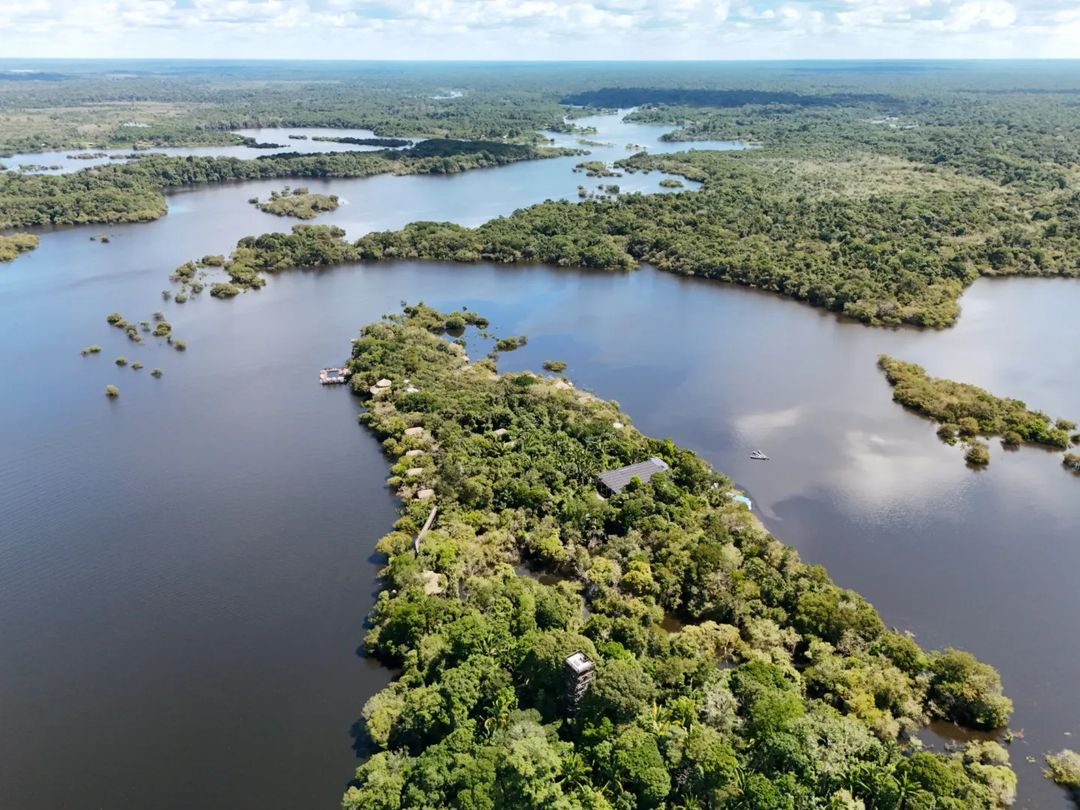 A lodge sits on a tributary deep in the heart of the Amazon rainforest.