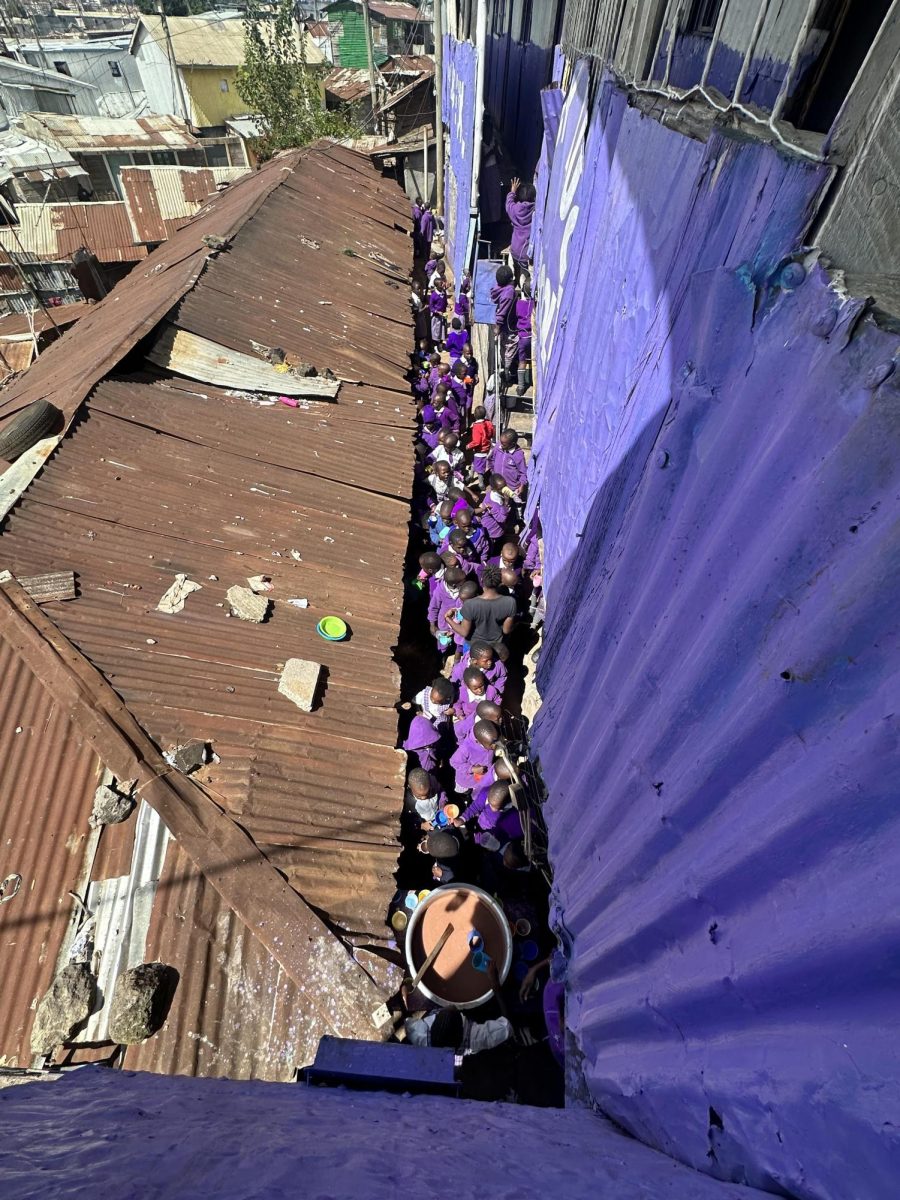 Children in Kenya lining up to get food at their school