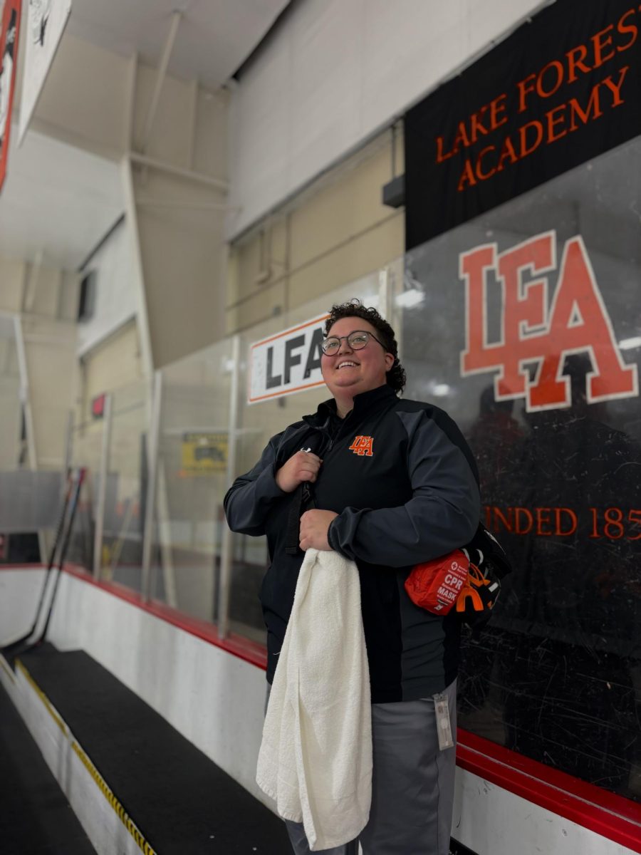 Jenni Gorey poses by LFA’s hockey rink, equipped with first aid necessities.