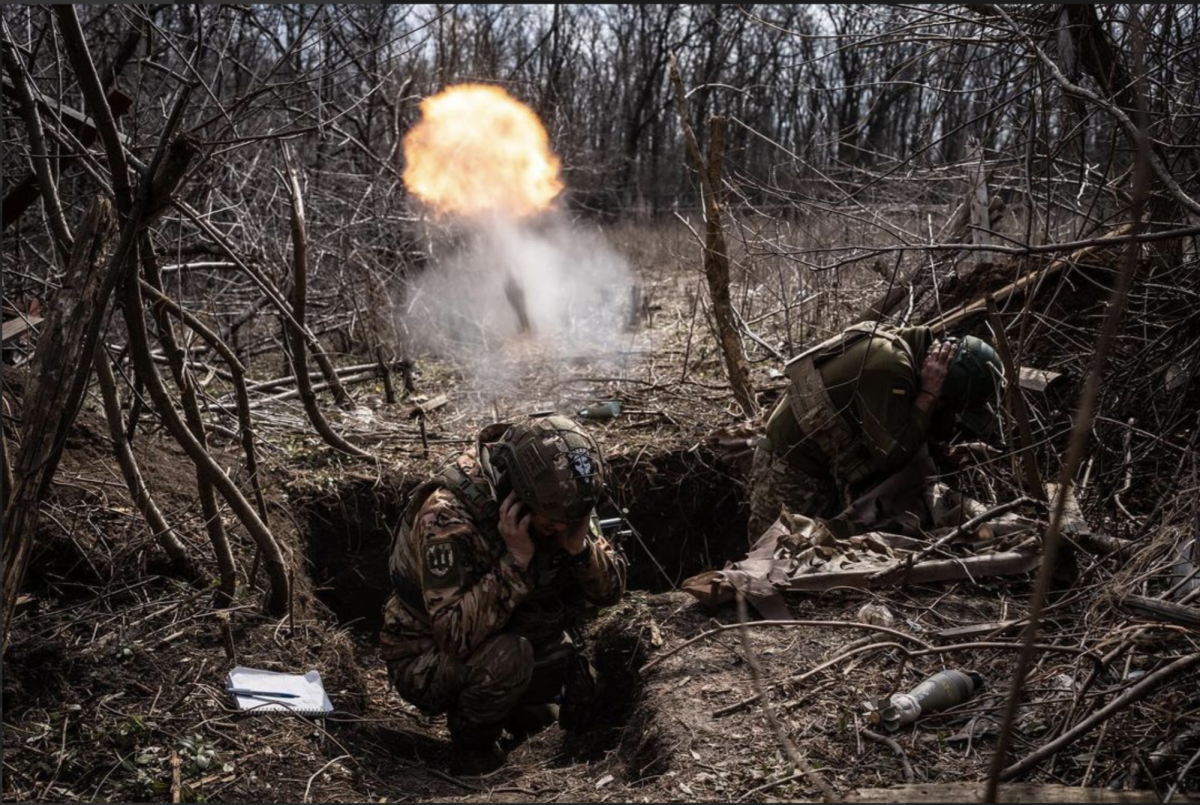 Soldiers take cover from grenade fire.