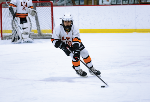 Serena Gilani ‘26 rushes with the puck up the ice in a game against Lake Forest High School.