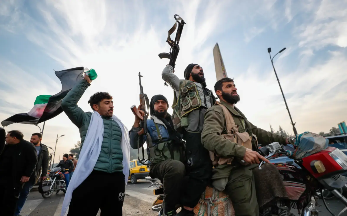 People celebrate in the streets after President Bashar al-Assad’s government in Syria collapsed. (Courtesy of AFP)