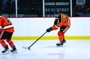 Ford Sweet ‘25 skates up the ice in a game against York Community High School.