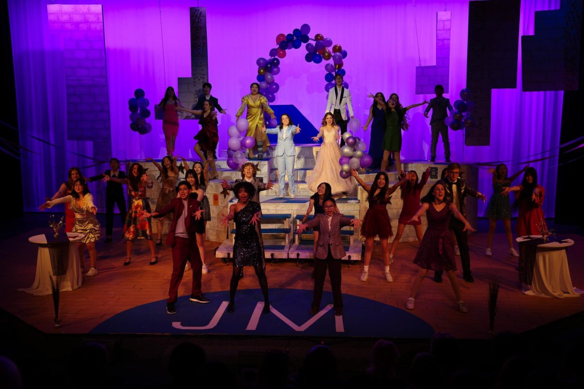 Cast members strike a final pose at the end of the opening number.