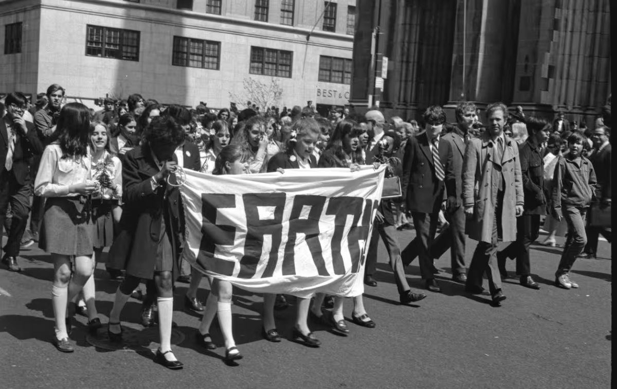 A group of people celebrate the first Earth Day in New York City.