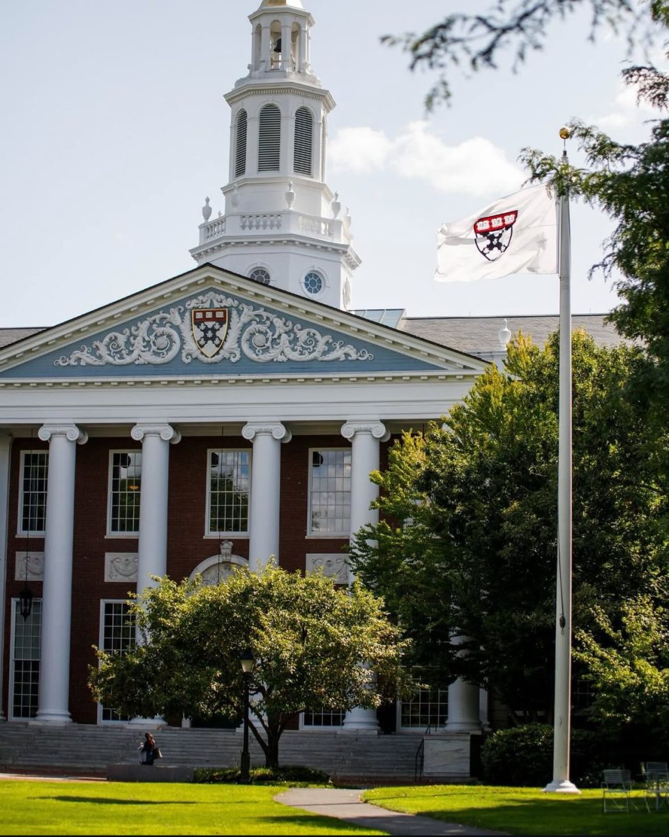 The Harvard University crest is displayed on Baker Library on campus.
