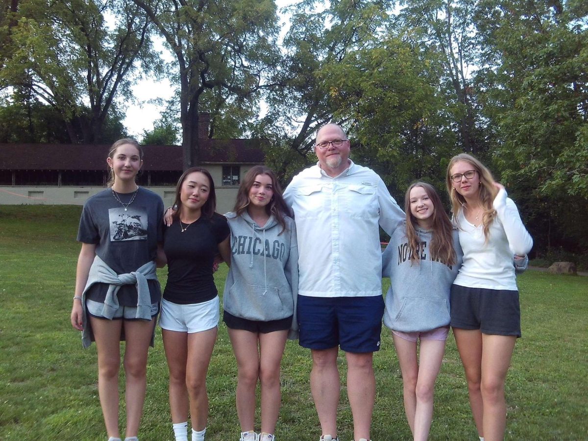 Lia Moore, Julie Park, Almira Tepe, Mike Hall, Kaylie Gast and Olivia Rogalski pose at the Senior Retreat.