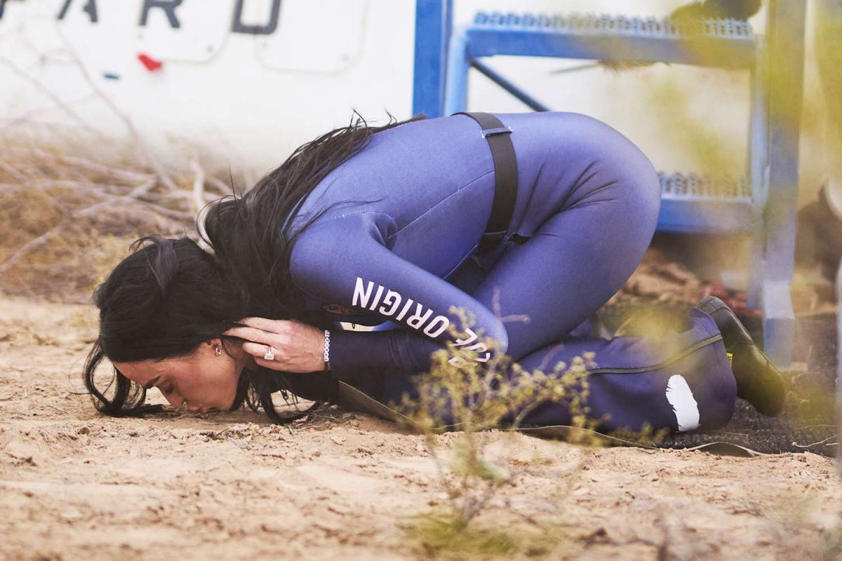 Katy Perry kisses the ground after returning from her Blue Origin flight.