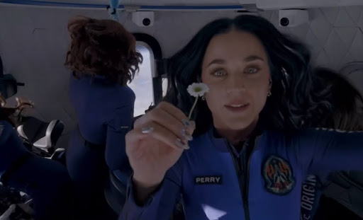Katy Perry holds a daisy aboard the New Shepard rocket in honor of her daughter.