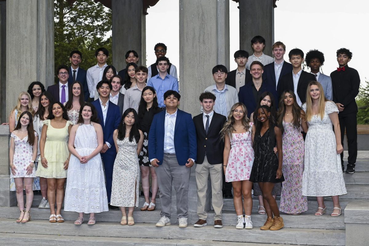 Student leaders pose for a photo in the Formal Gardens.
