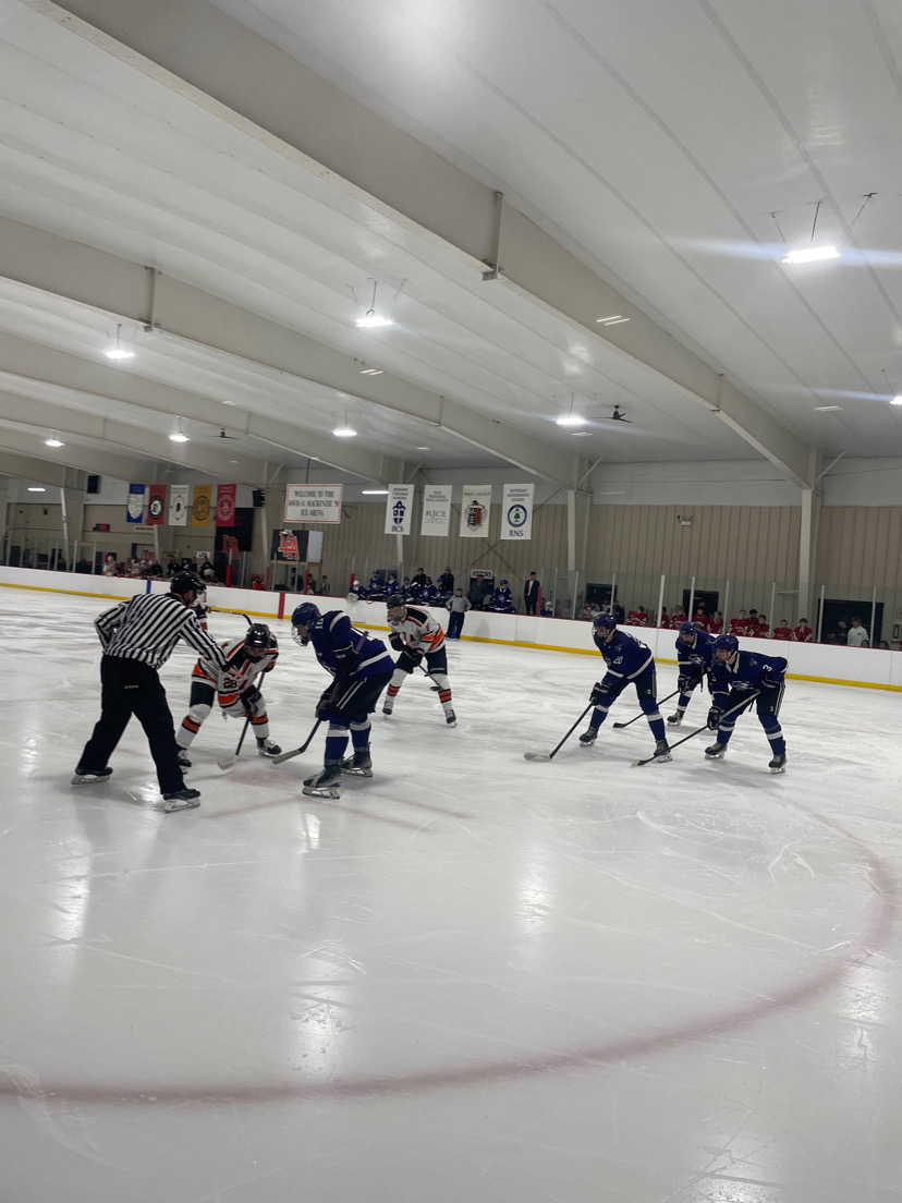Austin Baker faces off in the third period 