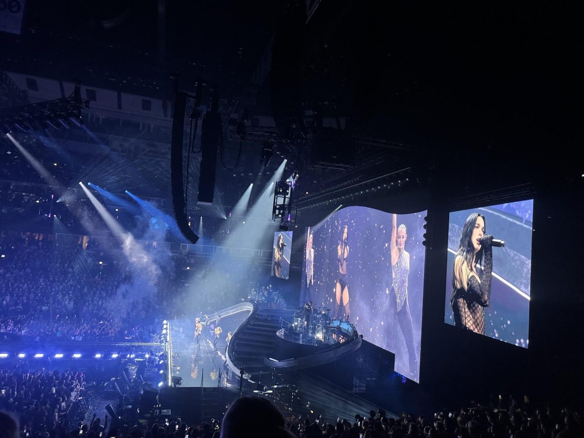 Dua Lipa lights up the stage during her Radical Optimism Tour in Chicago. 
