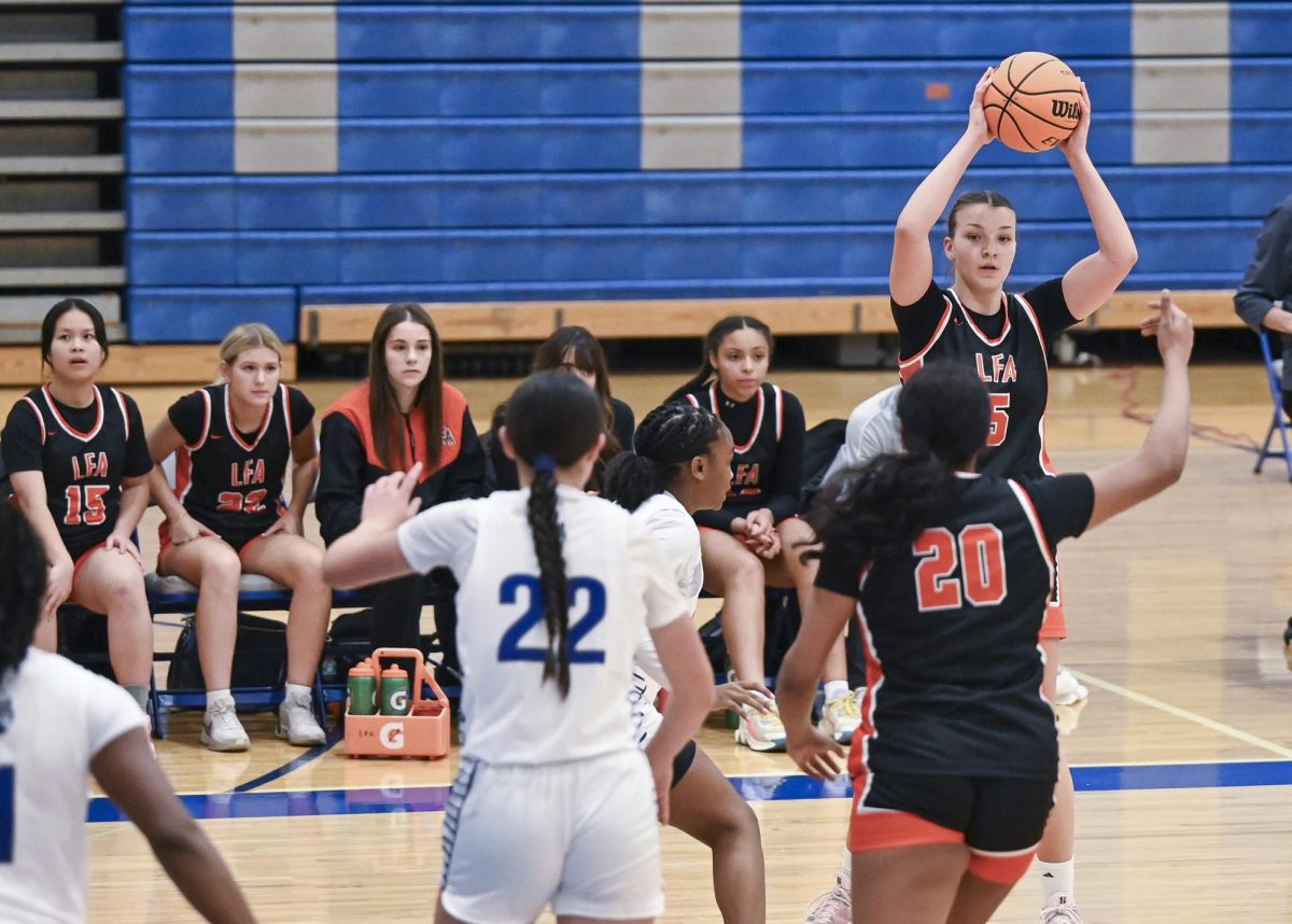 Blanka Devai ‘27 throws inbound pass to Akshara Ginjupalli ‘28 against Vernon Hills during the Cougar Classic game.