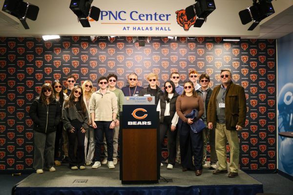 LFA Journalism students and teacher Mark Eleveld pose with Bears’ writers Larry Mayer and Gabby Hajduk in the press room.
