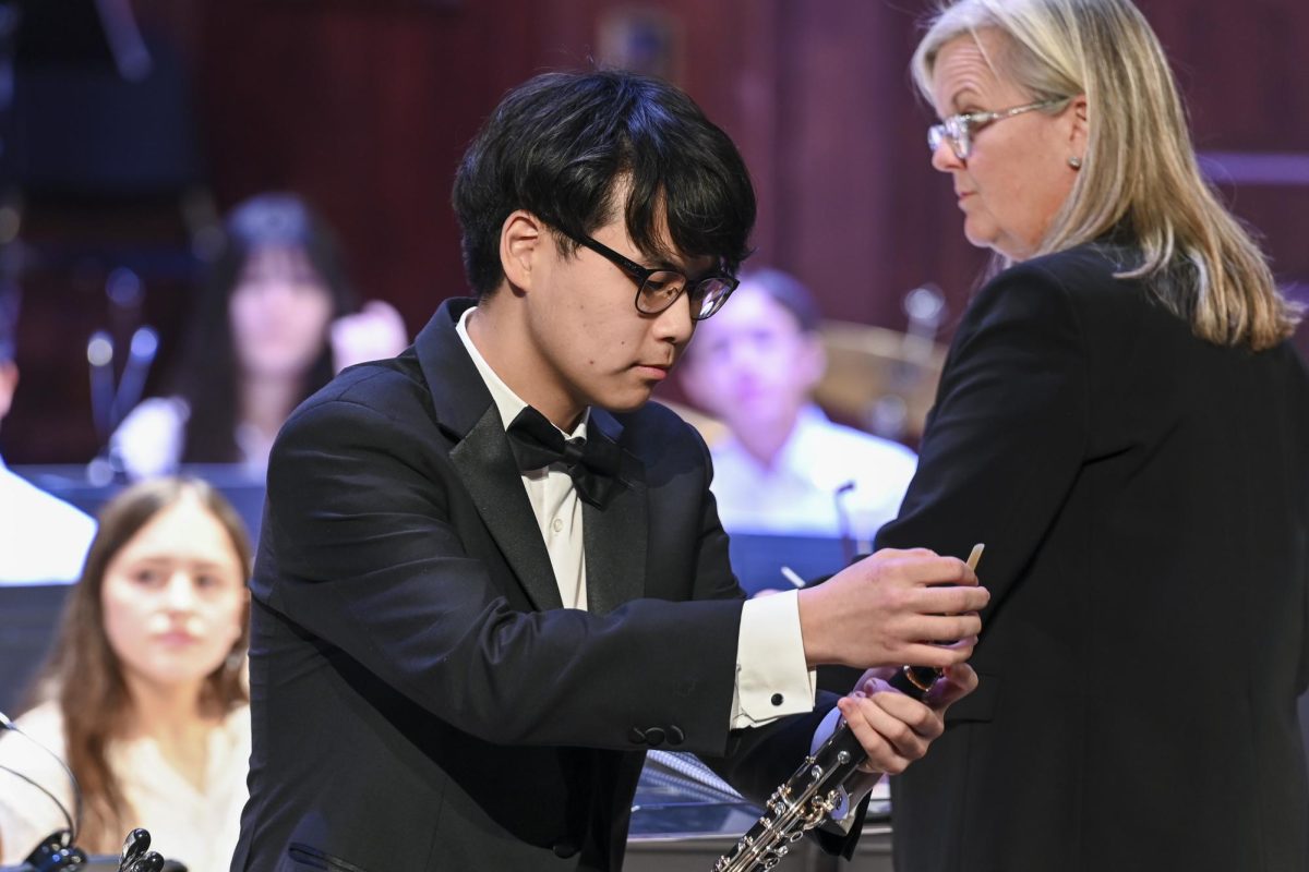 Davin Lee ‘26 prepares to play a concerto at the Fall Orchestra Concert.