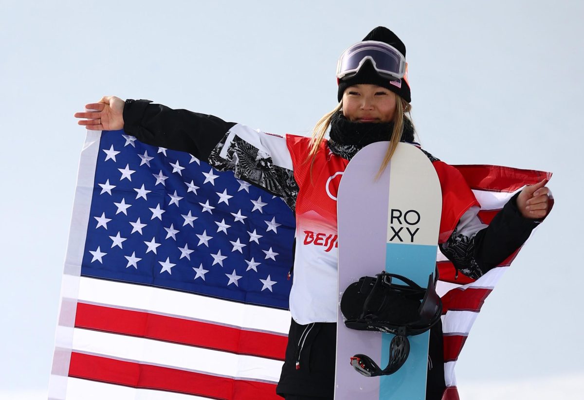 Gold medallist Chloe Kim of the United States celebrates during the flower ceremony.
