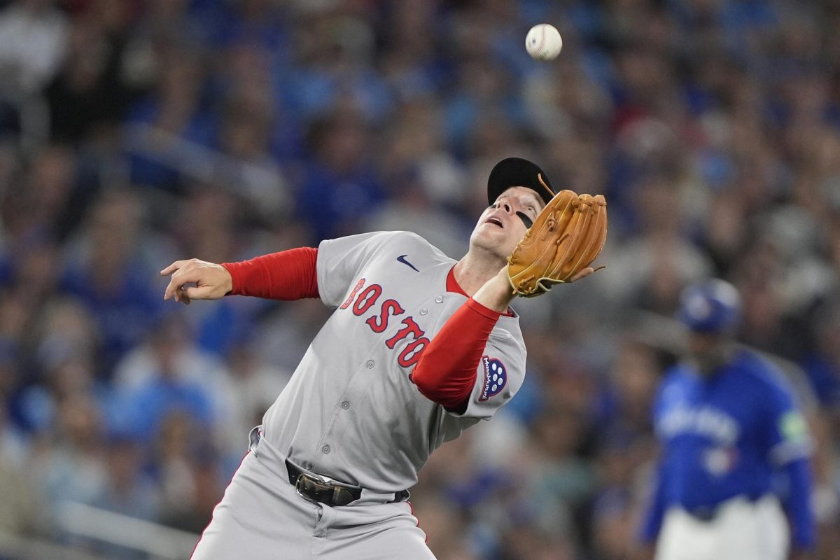 Boston Red Sox third baseman Alex Bregman catches a fly ball during the second inning at Rogers Centre.