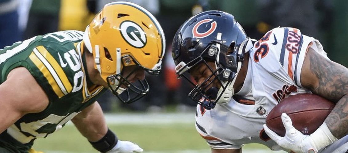 Zach Tom and Terrell Smith play football at Soldier Field.